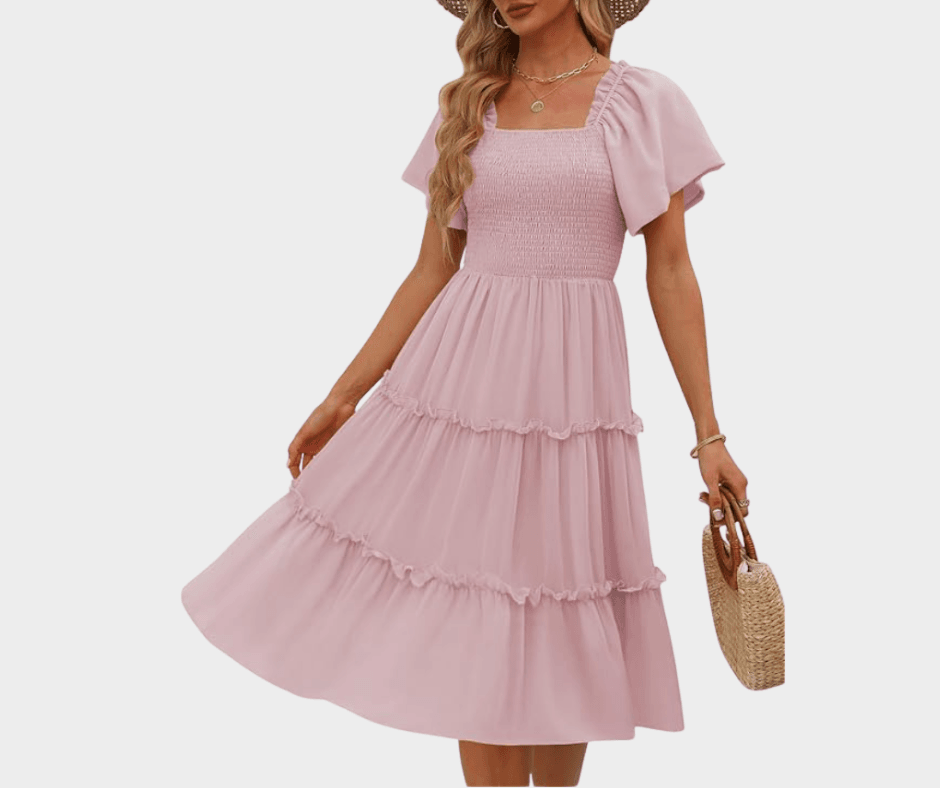 Romantic pink midi dress with ruffle tiers and flutter sleeves – perfect spring 2025 fashion trend for modern women