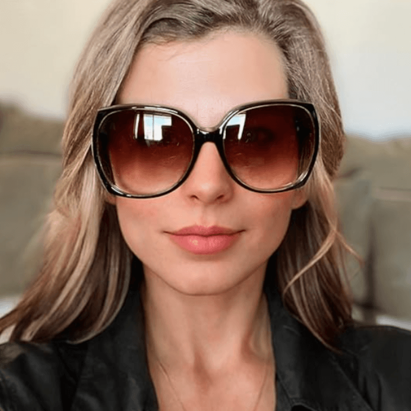 Woman wearing oversized geometric sunglasses – spring fashion accessory