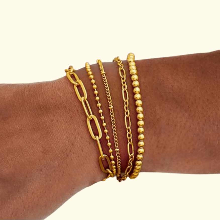 Stacked gold bracelets for women – trendy layered jewelry for spring 2025