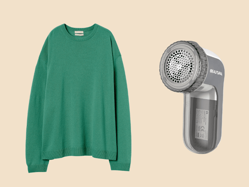 BEAUTURAL Fabric Shaver and Lint Remover next to a green sweater on beige background