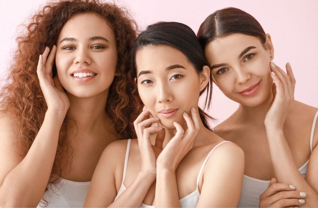 Group of diverse women showing healthy, glowing skin after following a minimalist skincare routine