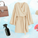 Flat lay with cleaning products for fashion and beauty – makeup brushes, jewelry, dress, handbag and sprays