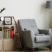 cozy reading nook with grey armchair and bookshelf – feminine home decor idea