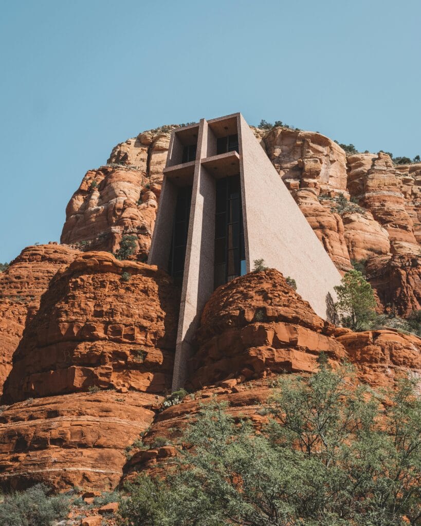 Chapel of the Holy Cross blending with Sedona’s red rocks under a clear blue sky.
