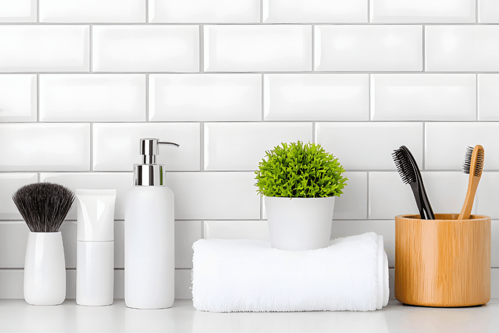 Minimalist bamboo bathroom accessories with white toiletries and a potted plant – affordable spa-style decor