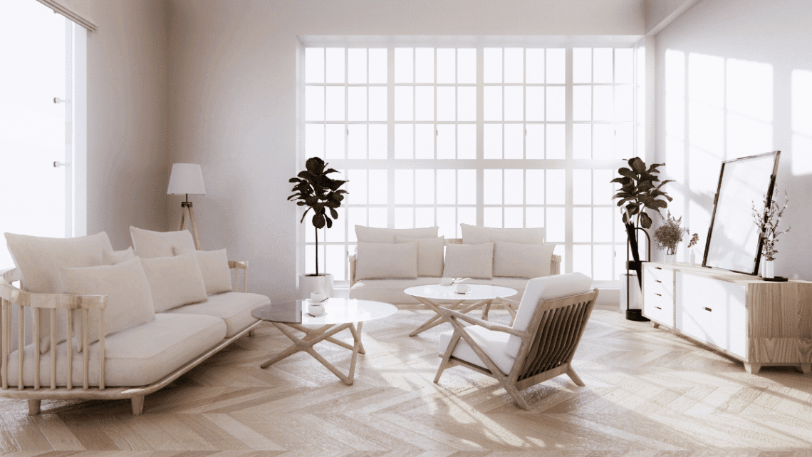 Bright Scandinavian-style living room with large windows, white and wood furniture, indoor plants, and a minimalist media console